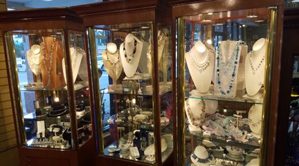 Jewelry display cases with necklaces and fine jewelry