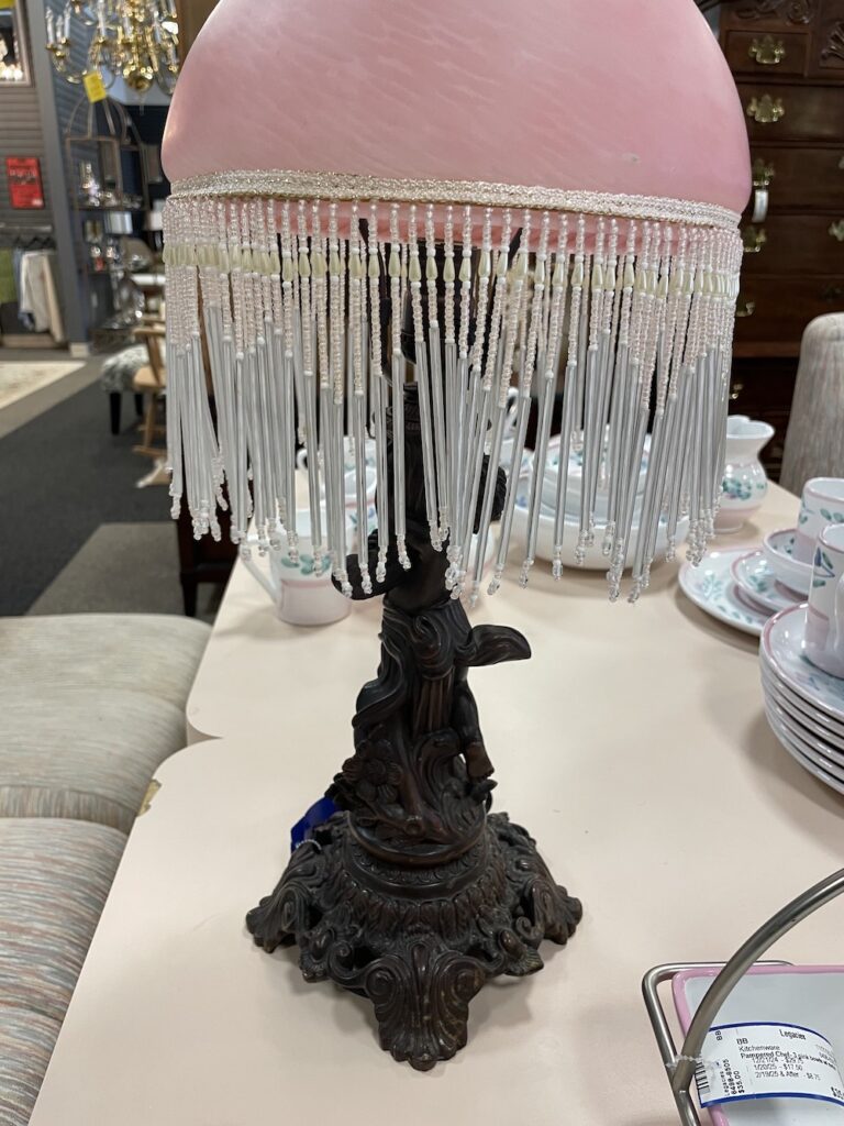 Victorian-style lamp with pink beaded fringe shade