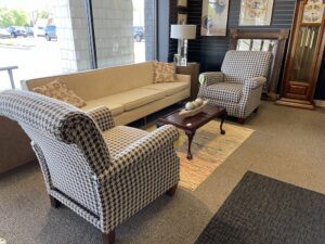 Sofa and two armchairs arranged around a coffee table