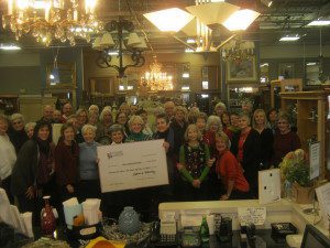 Legacies volunteers presenting a donation check to Cancer Support Community