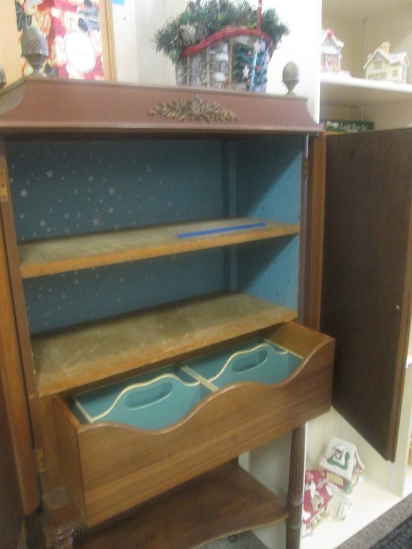 Vintage wooden cabinet with open drawer