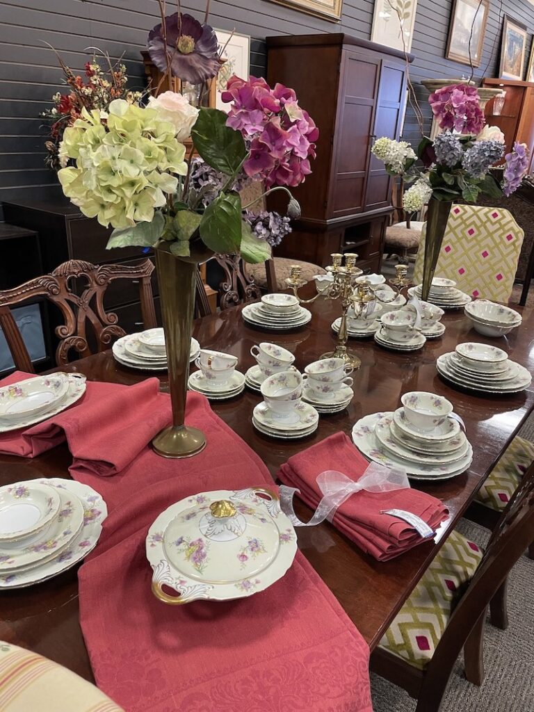 Floral china dinnerware set displayed on a dining table