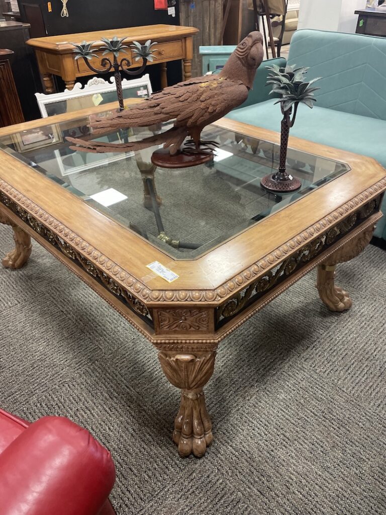 rnate carved wood and glass coffee table with claw feet